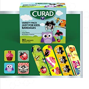 Box of CURAD Variety Pack Just for Kids Bandages, featuring 80 bandages in assorted sizes. The box is decorated with 4 fun themes including illustrations of an owl, pirate, bee, and other cute characters for all-purpose protection.